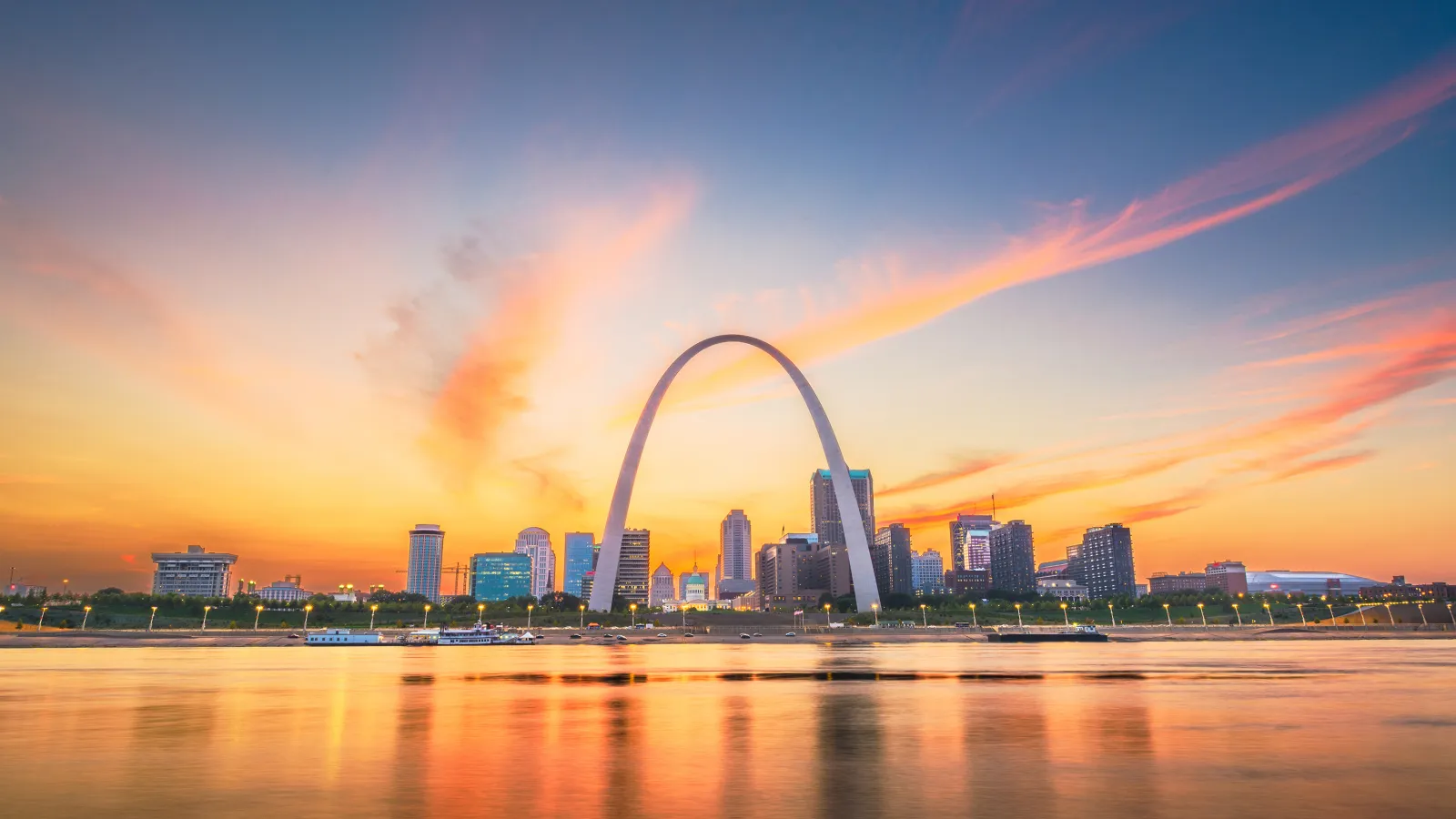 a city skyline with a rainbow