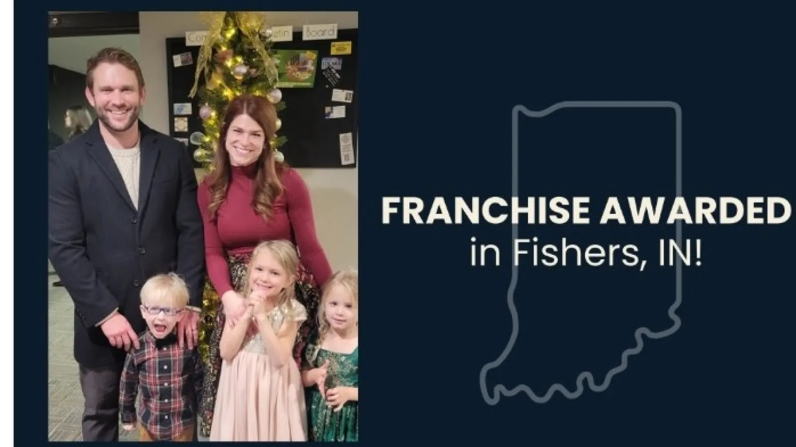 Family of five standing indoors near a decorated Christmas tree celebrating franchise award in Fishers, Indiana.