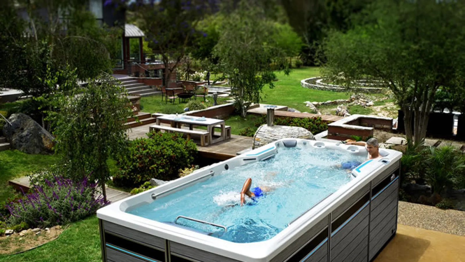 a swim spa with a couple of people in it