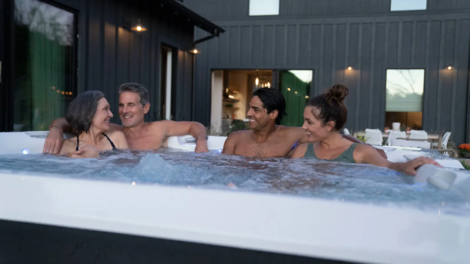 a group of people in a hot tub