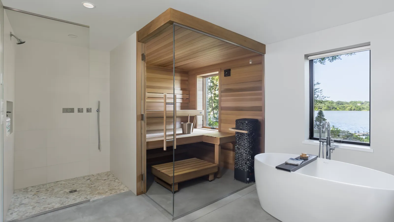 a bathroom with a tub and a bed