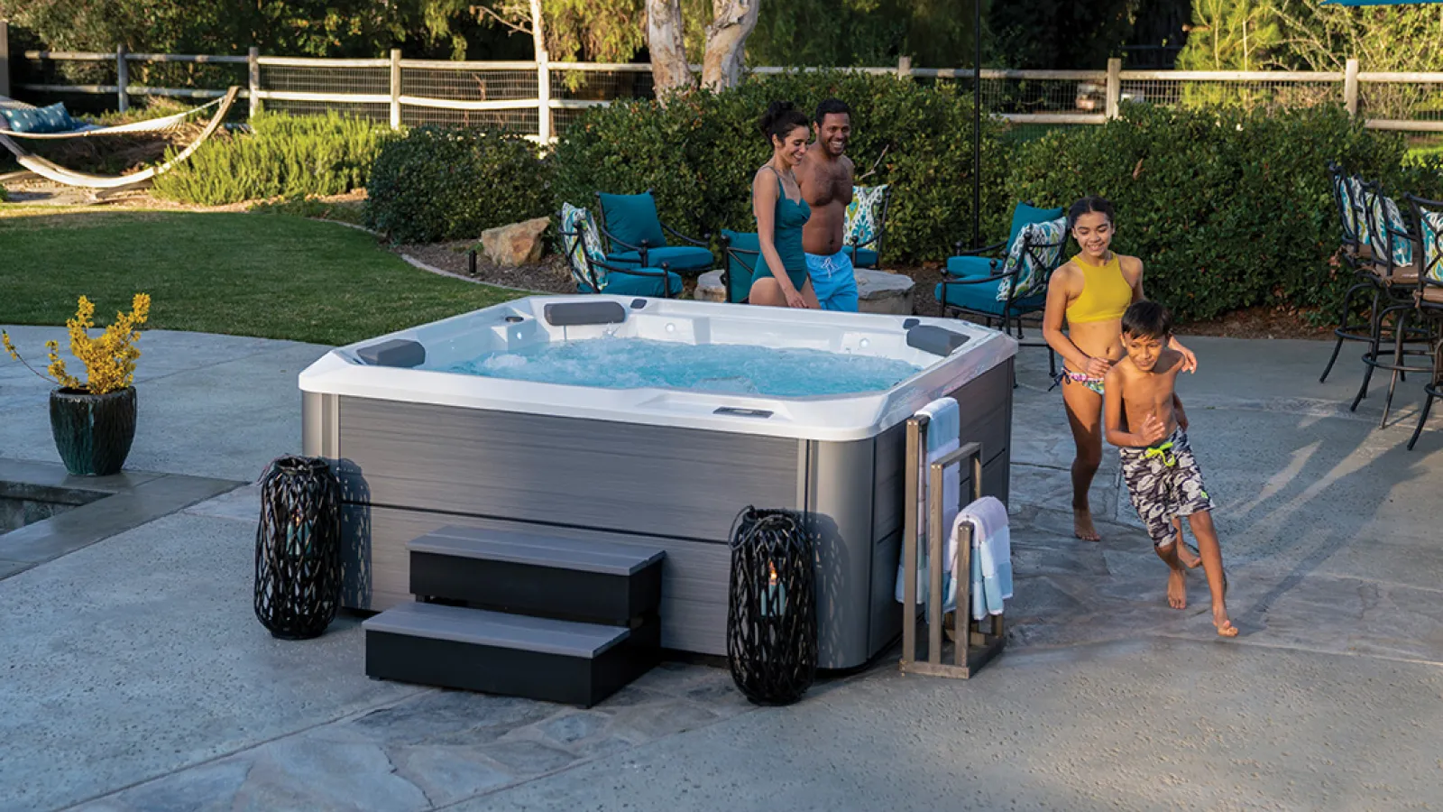 a group of people standing around a pool