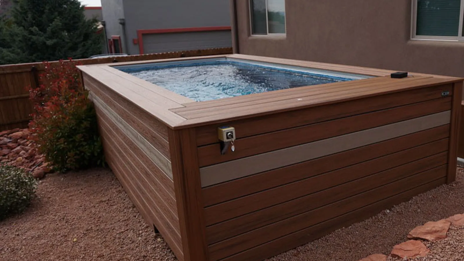 a wooden pool in a backyard