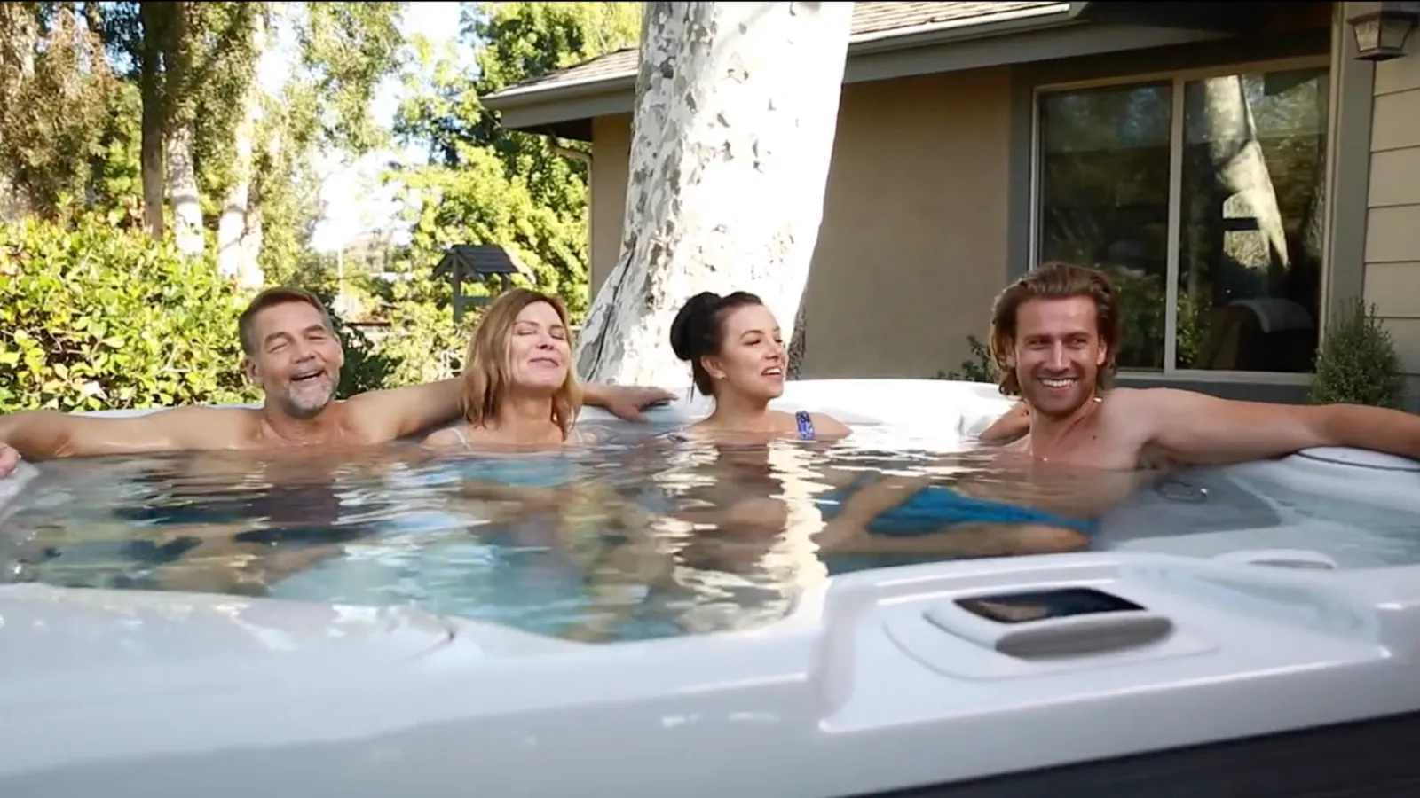 a group of people in a hot tub