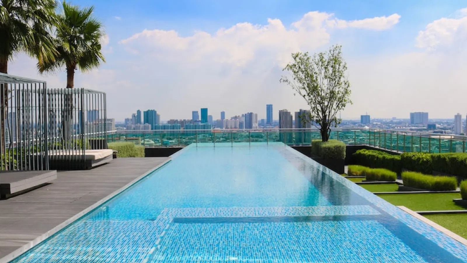 a pool with a city in the background