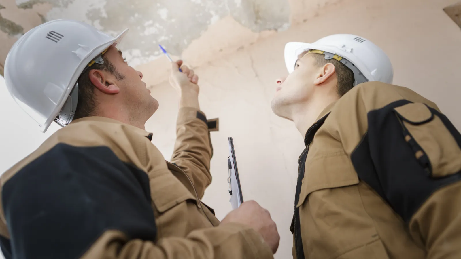 a few men wearing hard hats