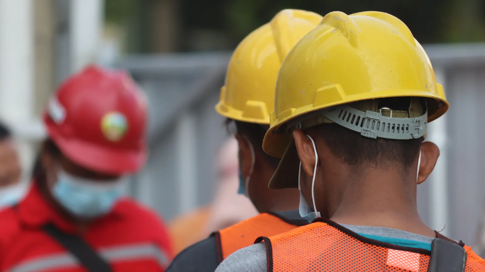 a person wearing a yellow helmet