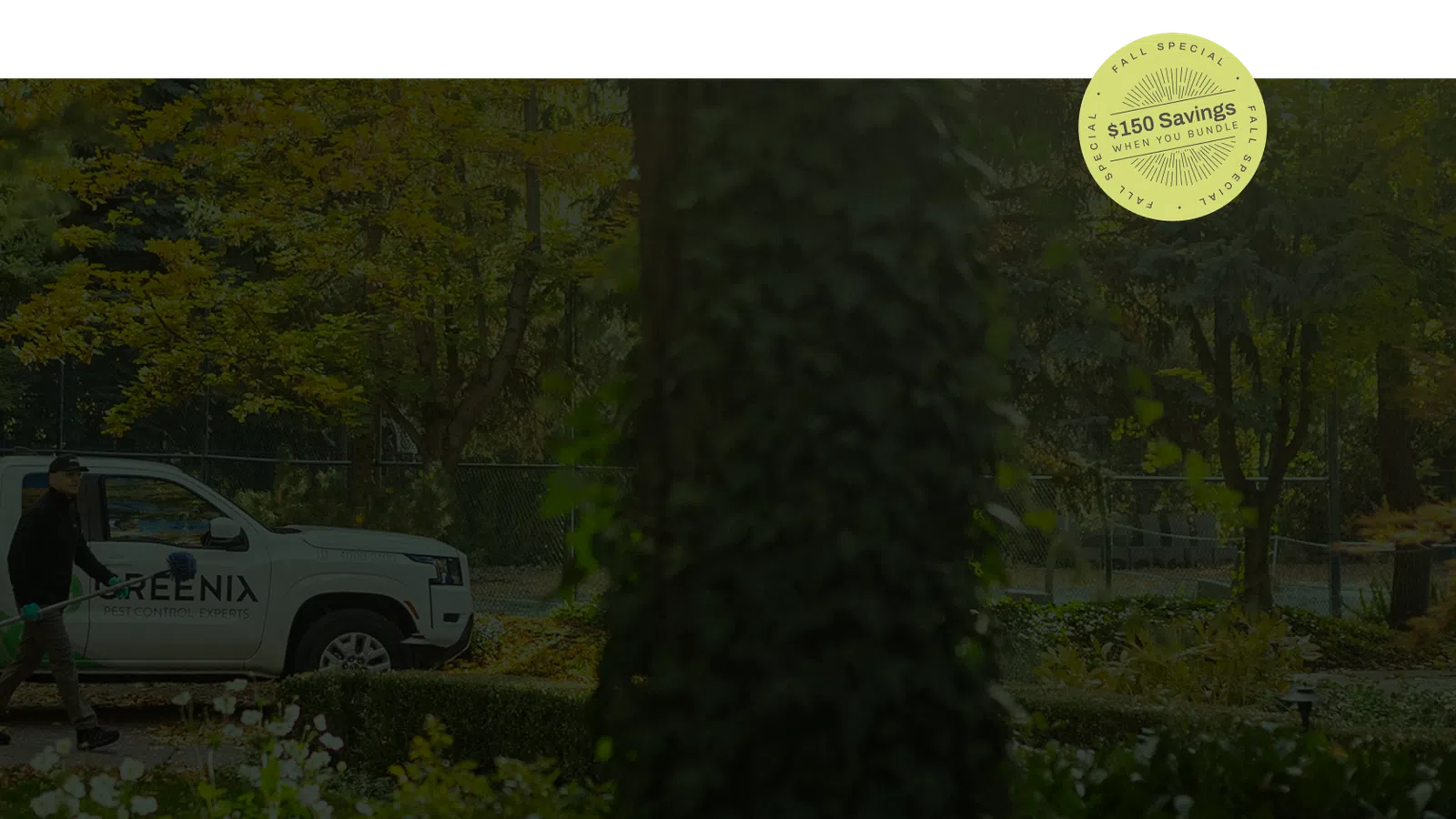 Greenix pest control technician walking with equipment near branded truck in a green outdoor garden.