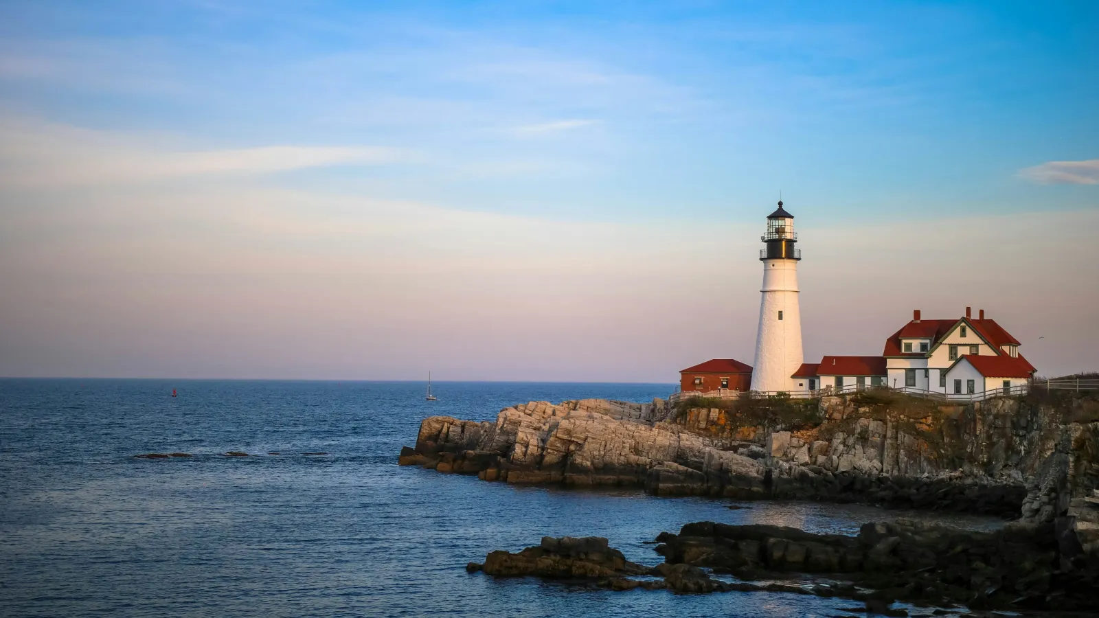 a lighthouse on a rocky island