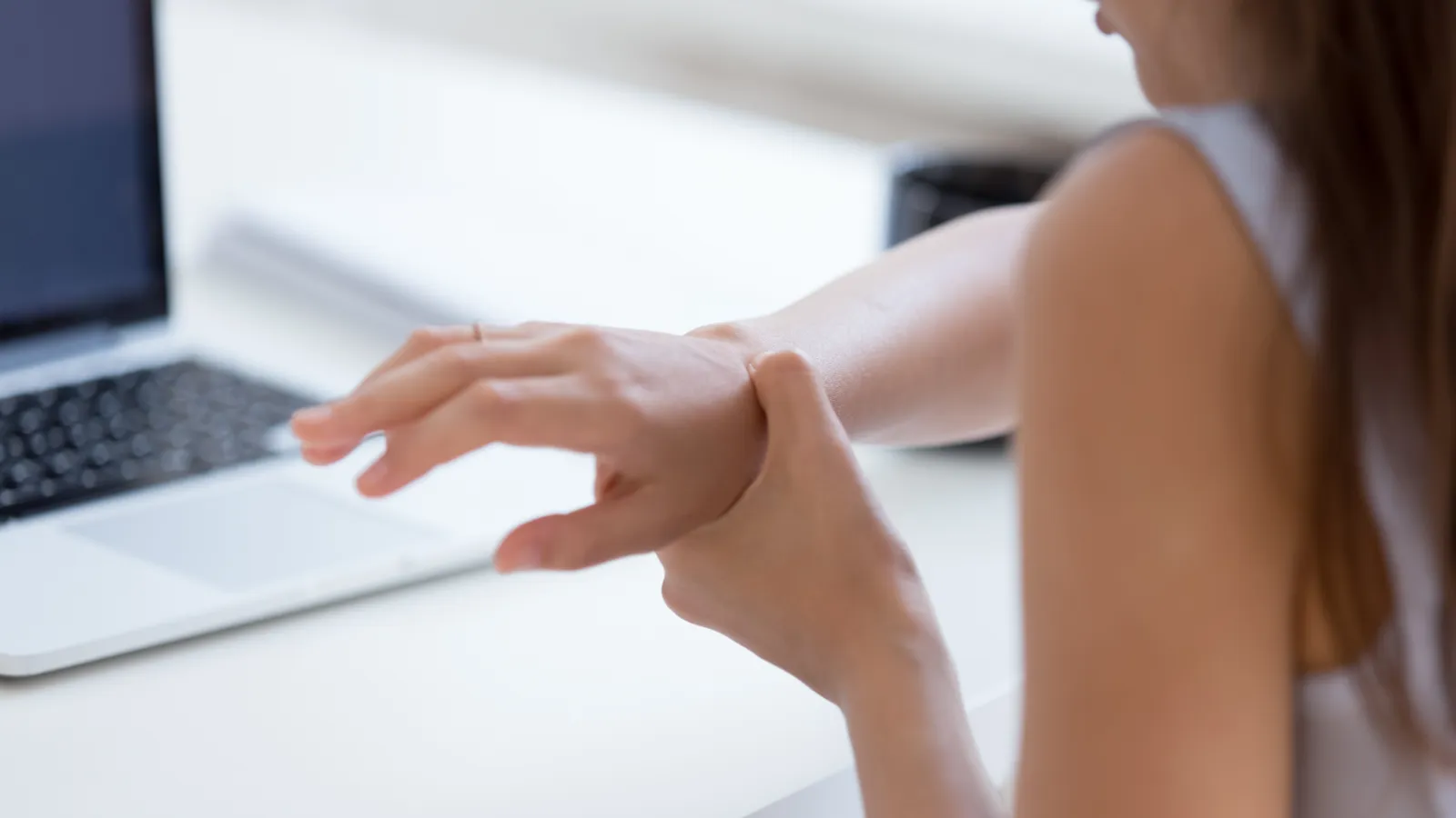 a woman holding her wrist