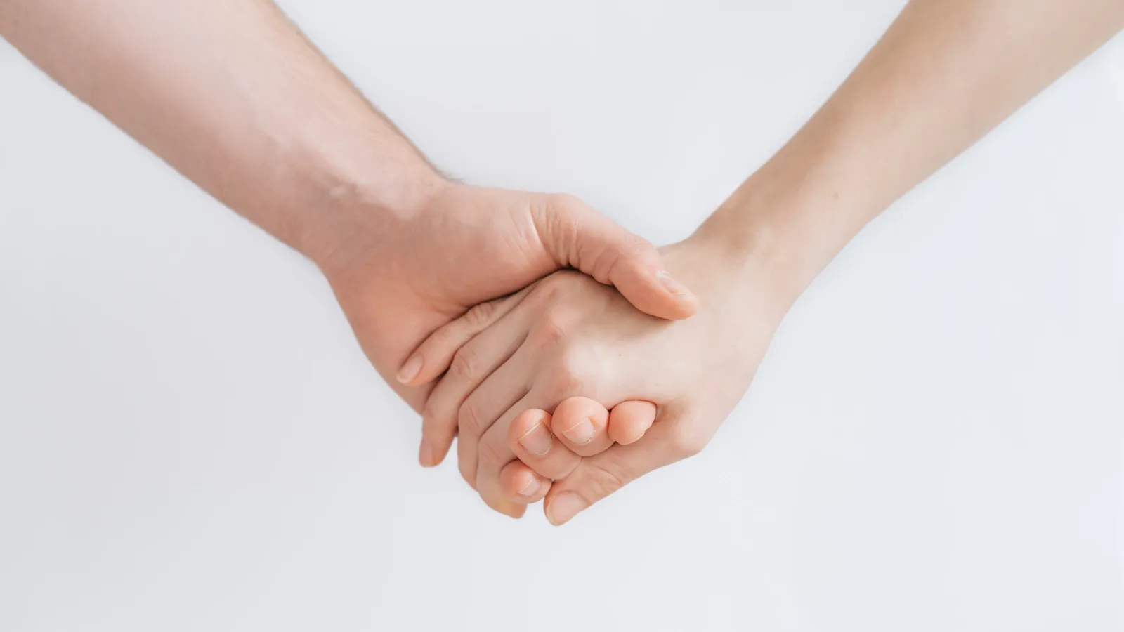 a close-up of a hand and a person's hand