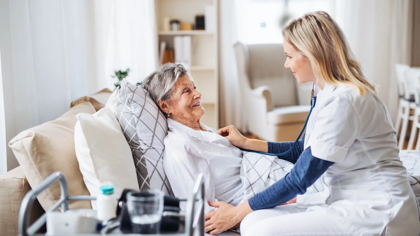 a doctor checking a patient's blood pressure
