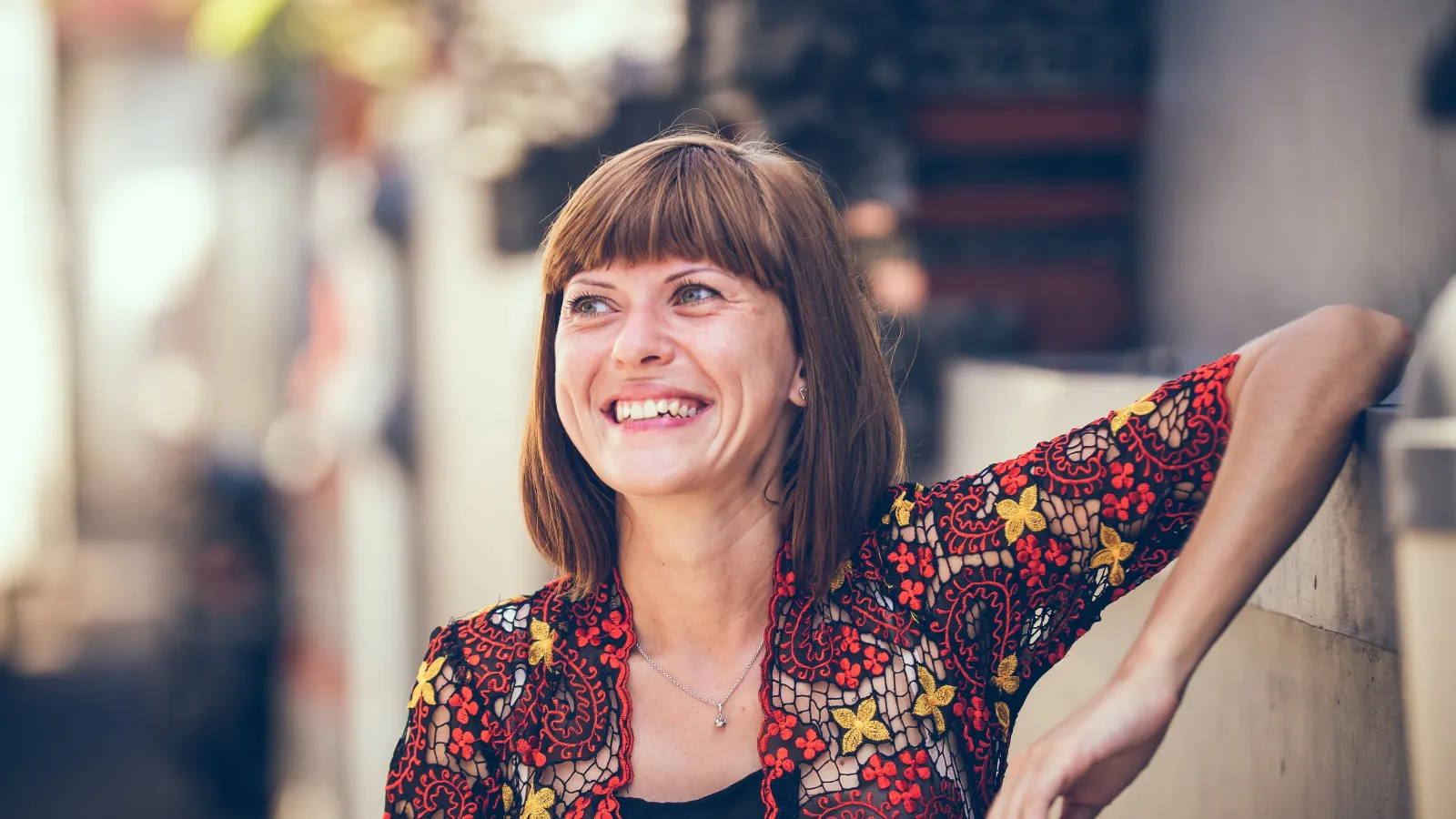 a woman with her arms crossed