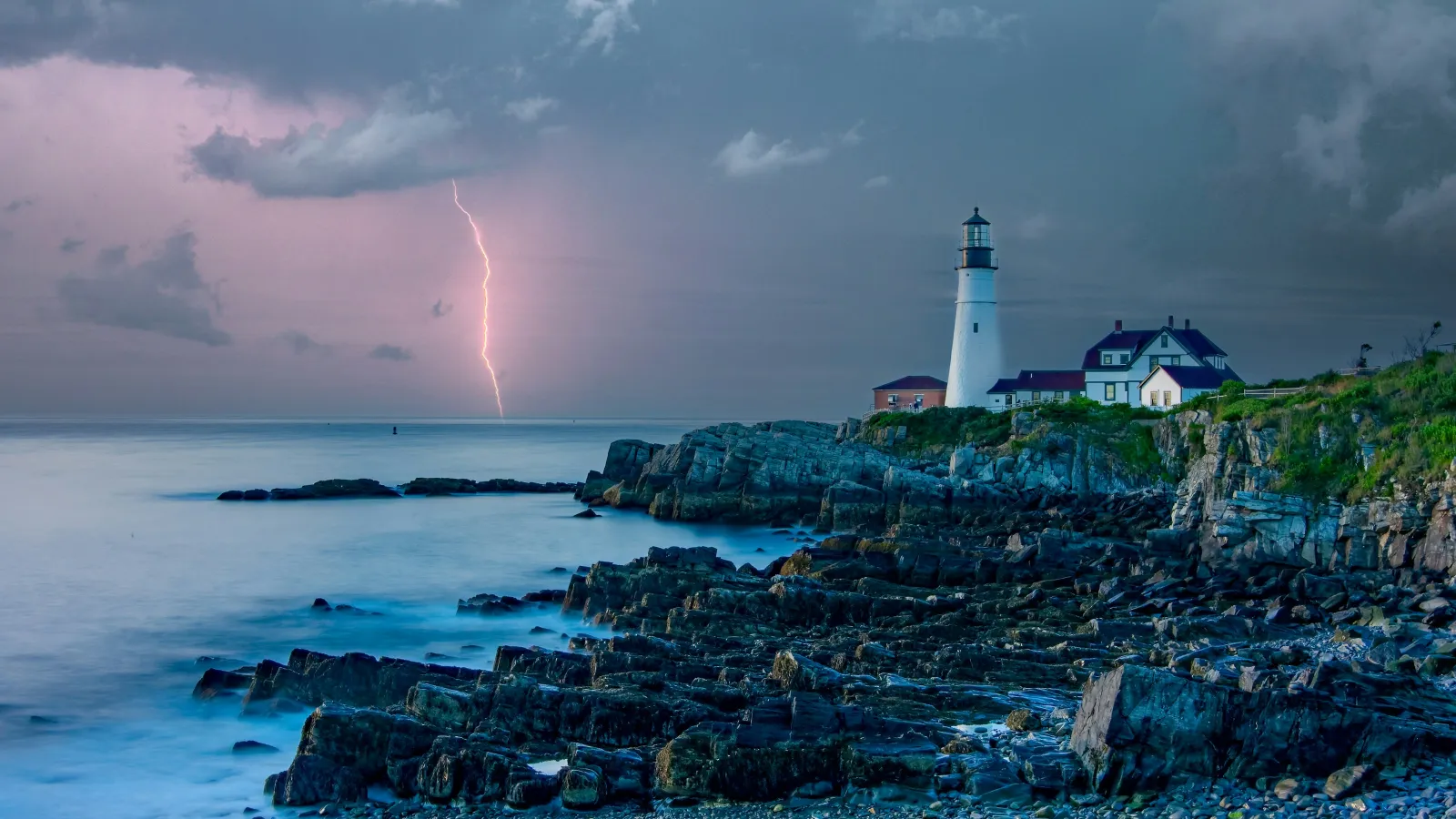 a lighthouse on a rocky island