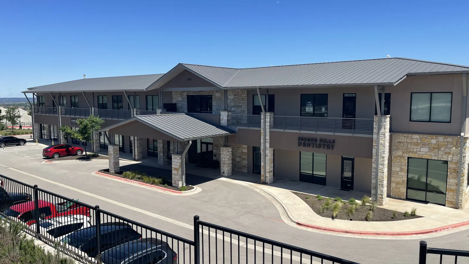 a building with cars parked in front
