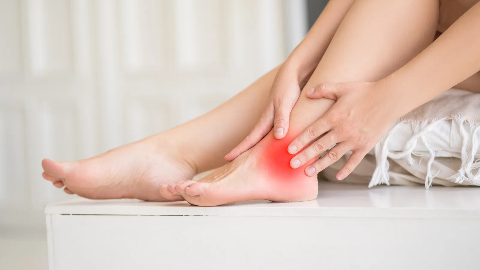 a womans feet on a white surface