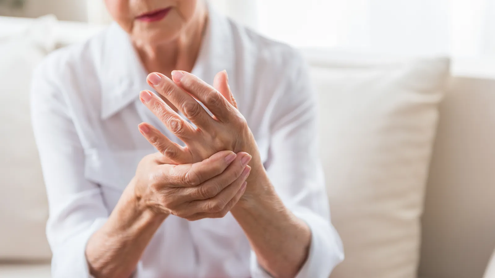 a woman holding her wrist