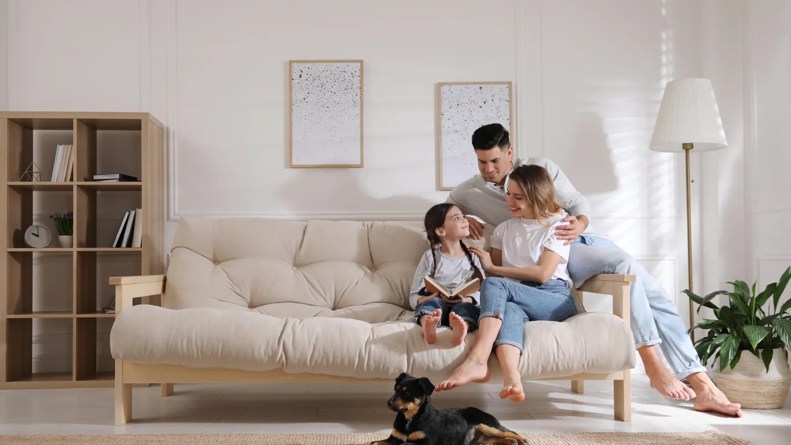 a family sitting on a couch