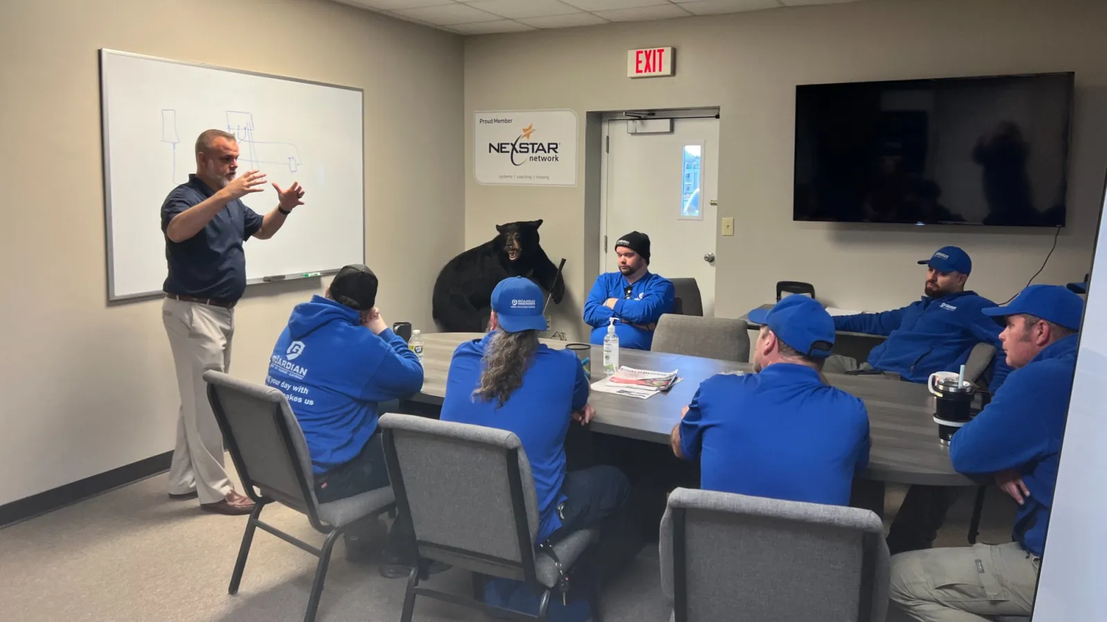 a person giving a presentation to a group of people