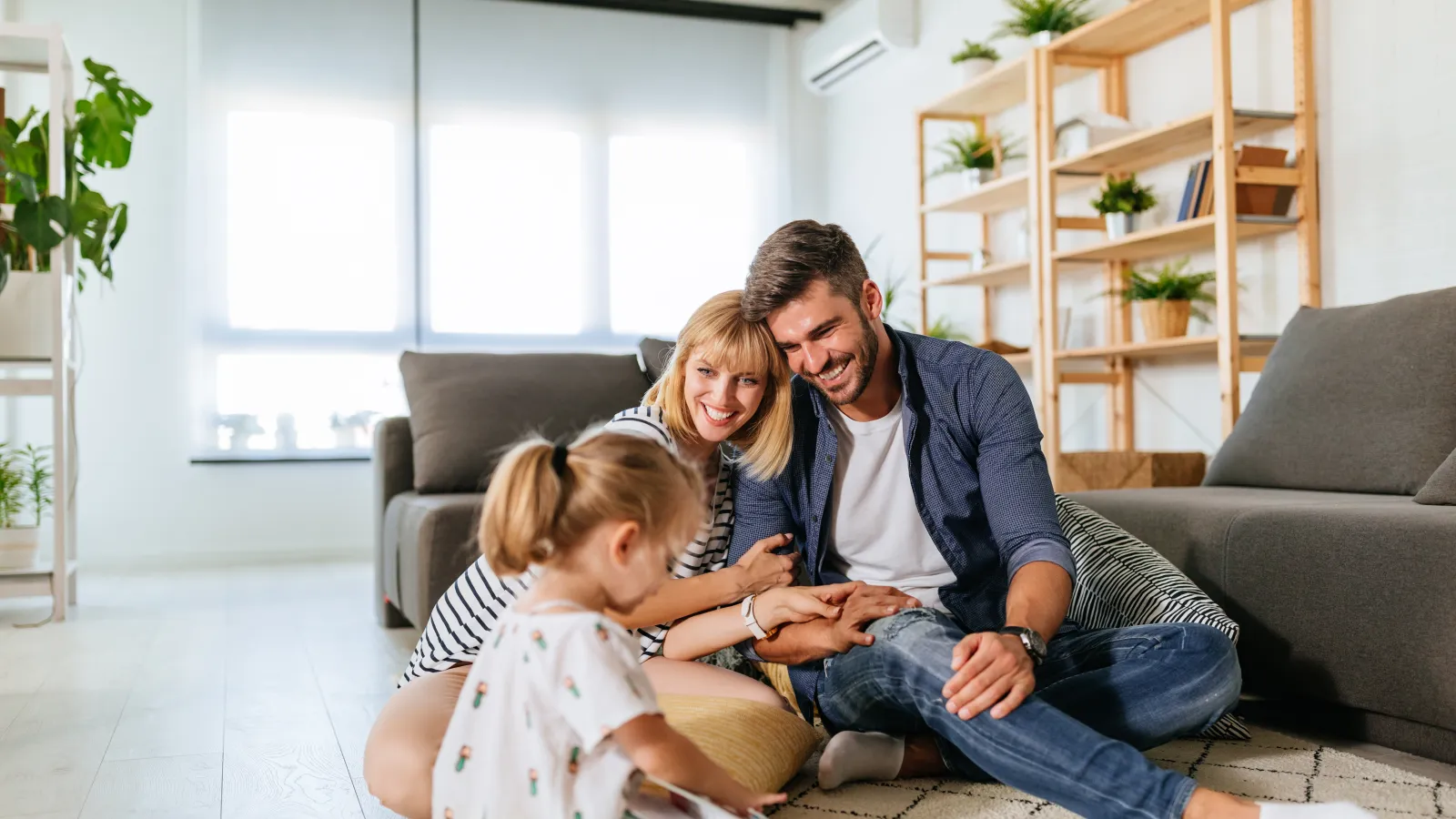 a family sitting on a couch