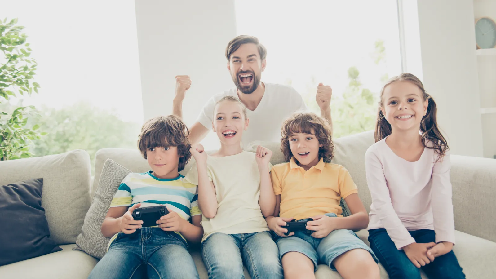 a family sitting on a couch