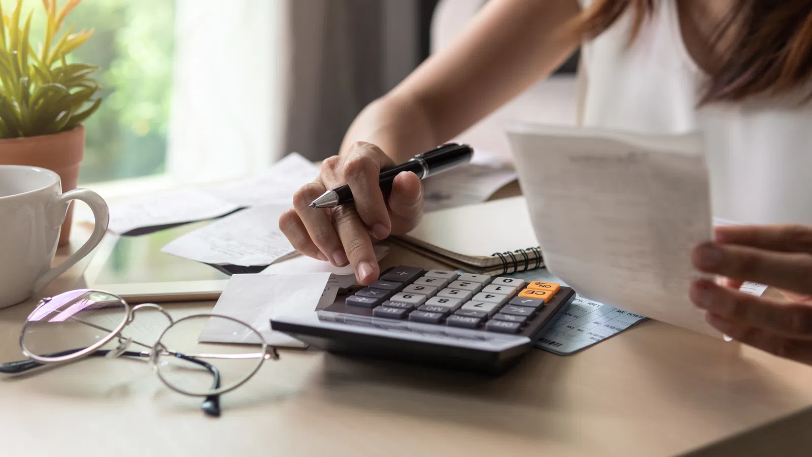 a woman using a calculator