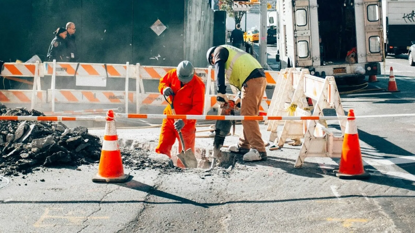 a group of men working on a road