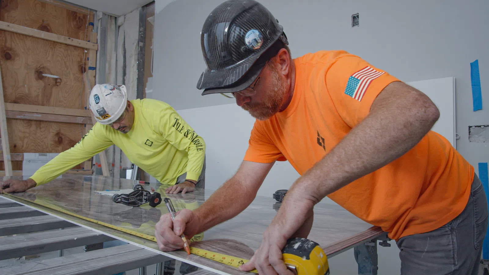 men wearing hard hats working on a machine