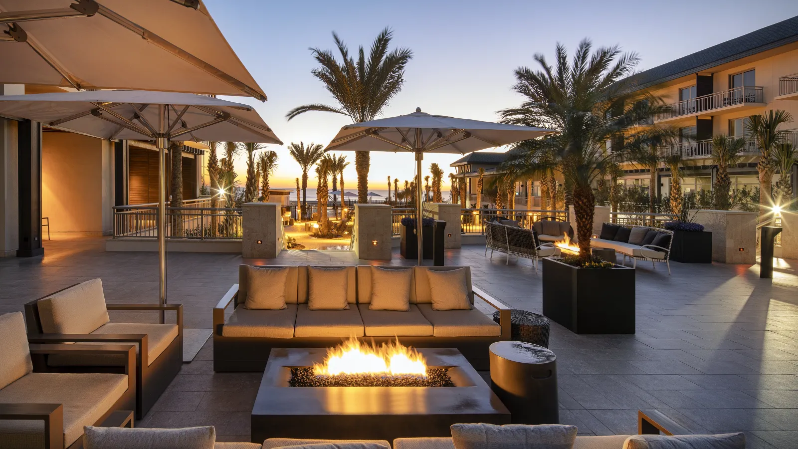 a pool with lounge chairs and umbrellas