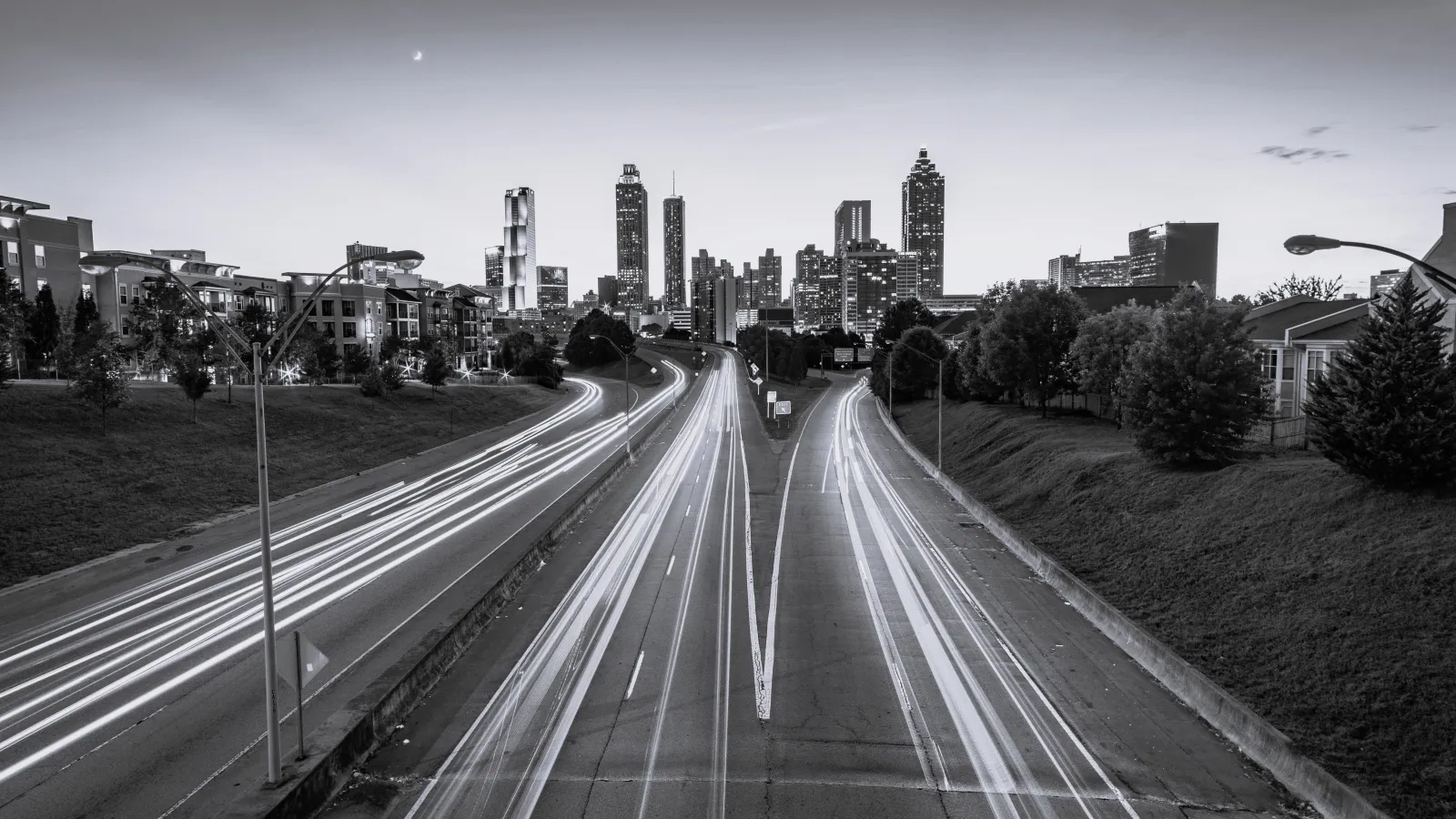 a road with a city in the background