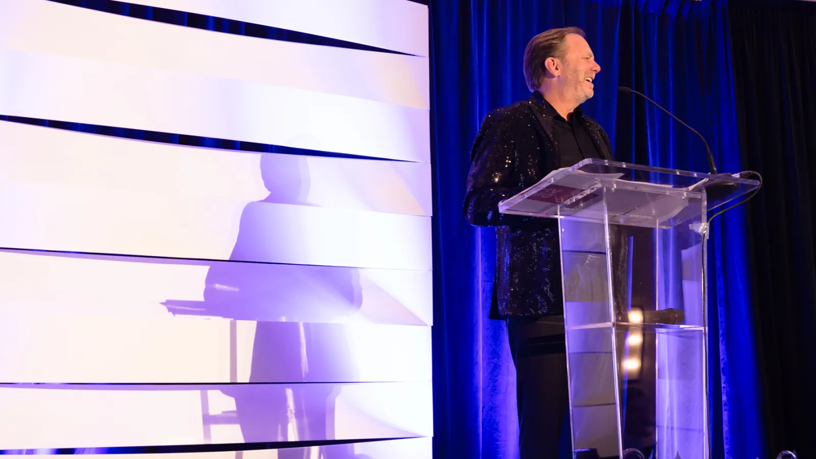 a man standing in front of a podium