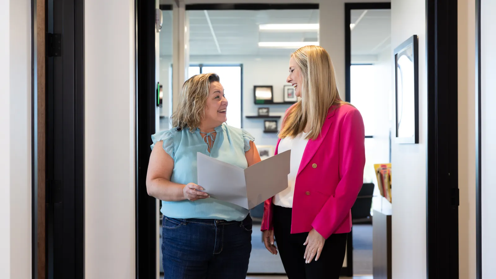 women talking in an office