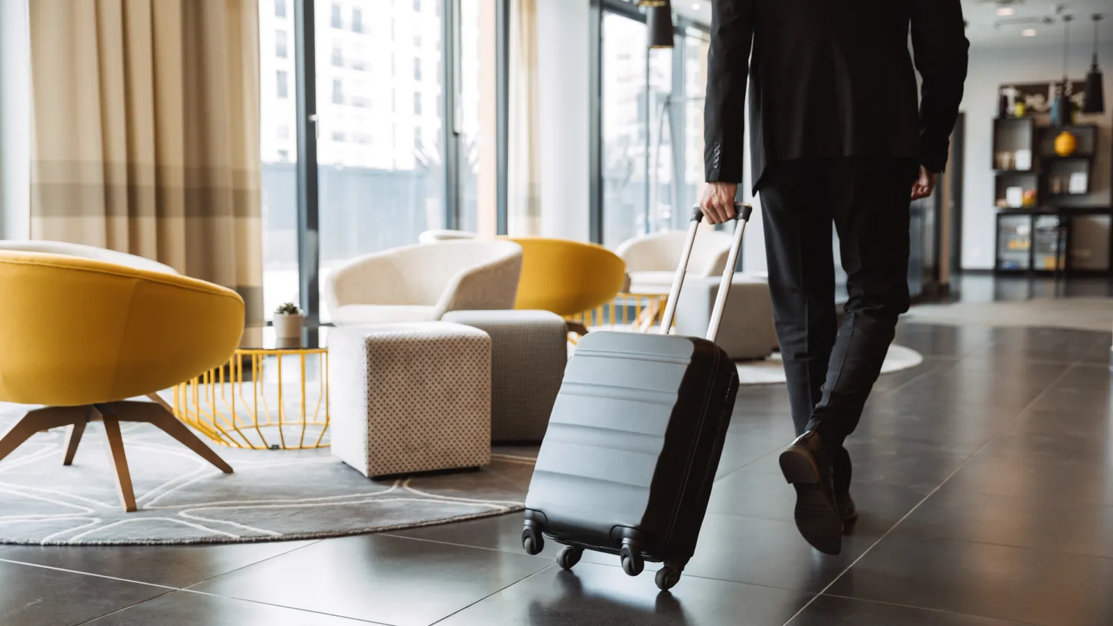 a person pulling a suitcase