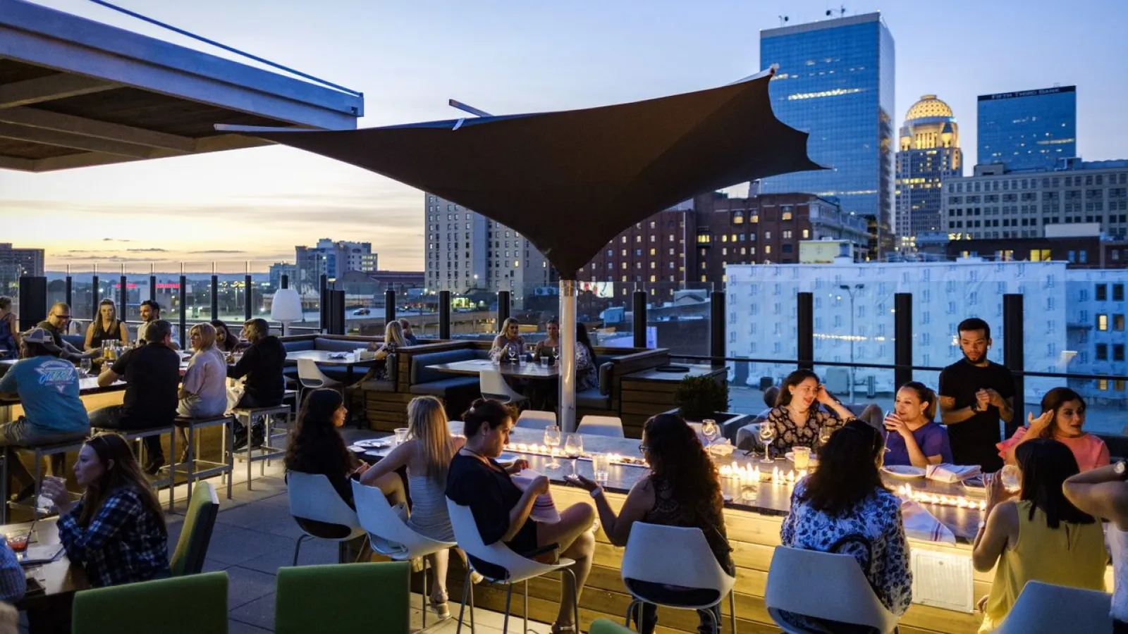 a group of people sitting at tables