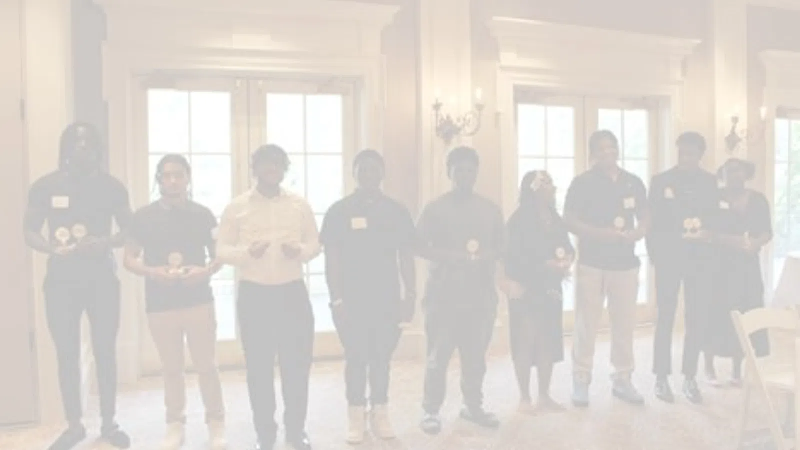 a group of people standing in a room