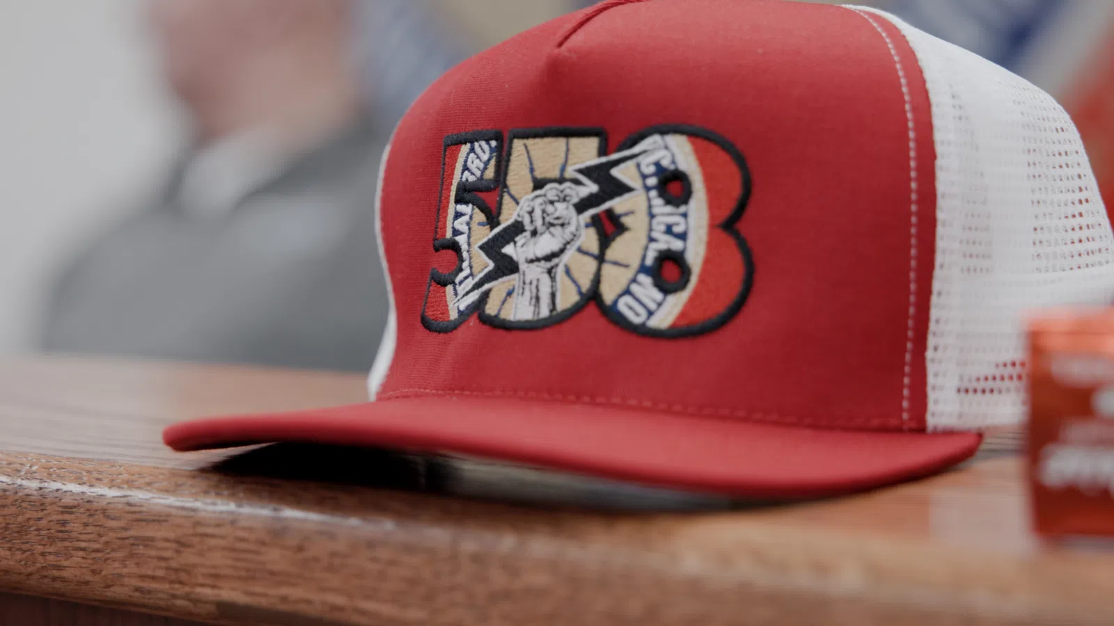 a red and white baseball cap