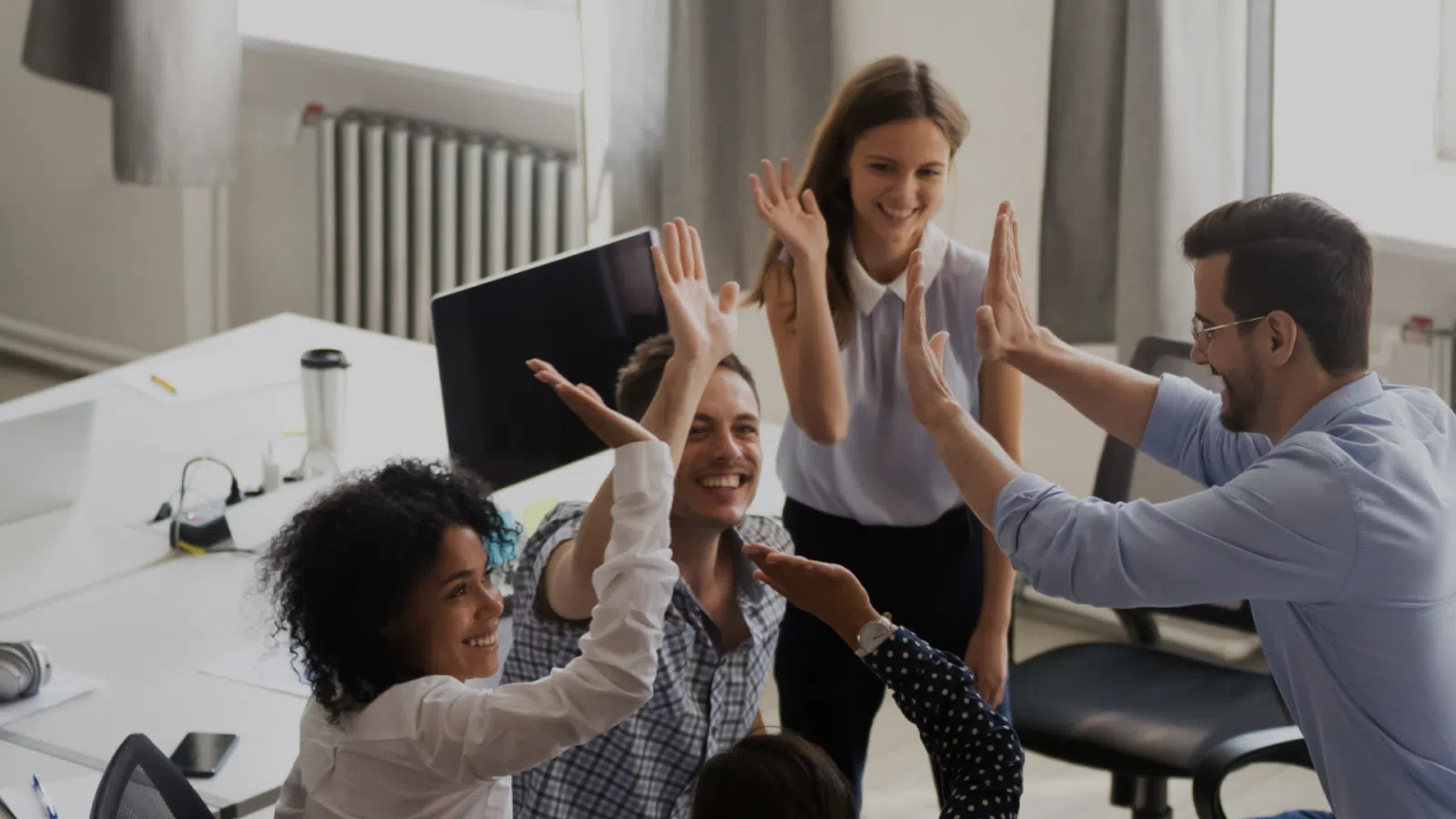 a group of people clapping