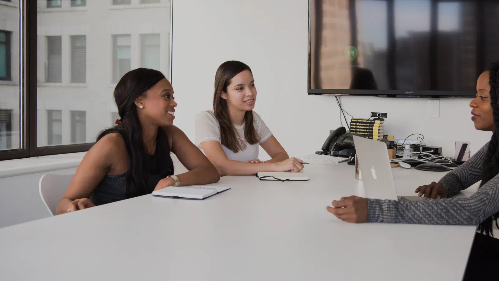 a group of women sitting at a table