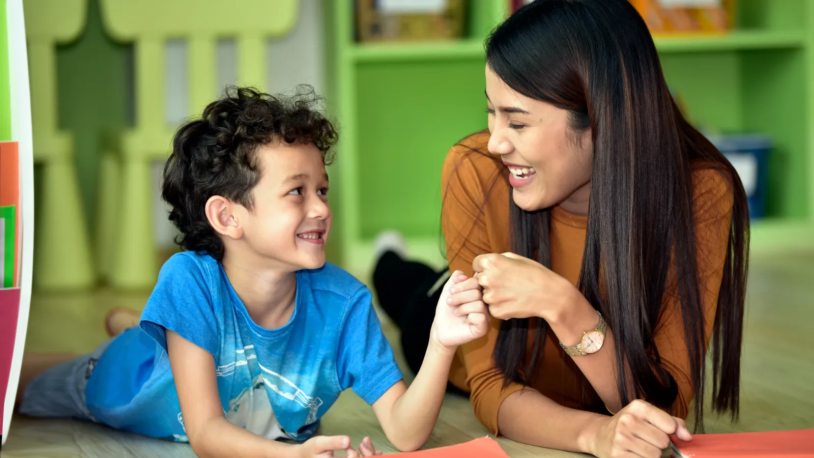a woman and a child sitting at a table