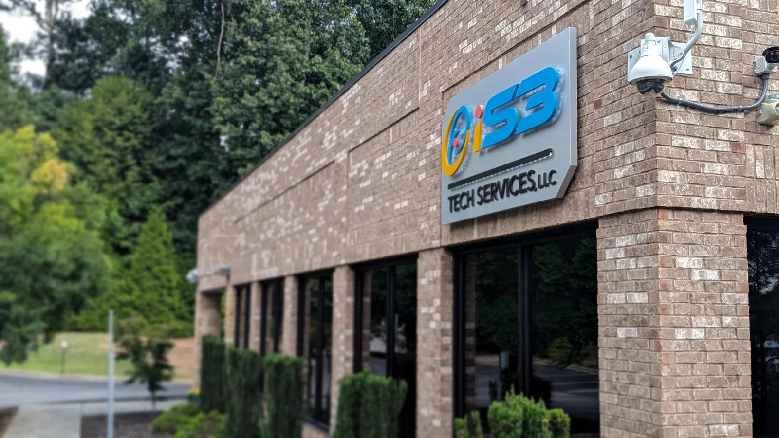 a brick building with a sign on it