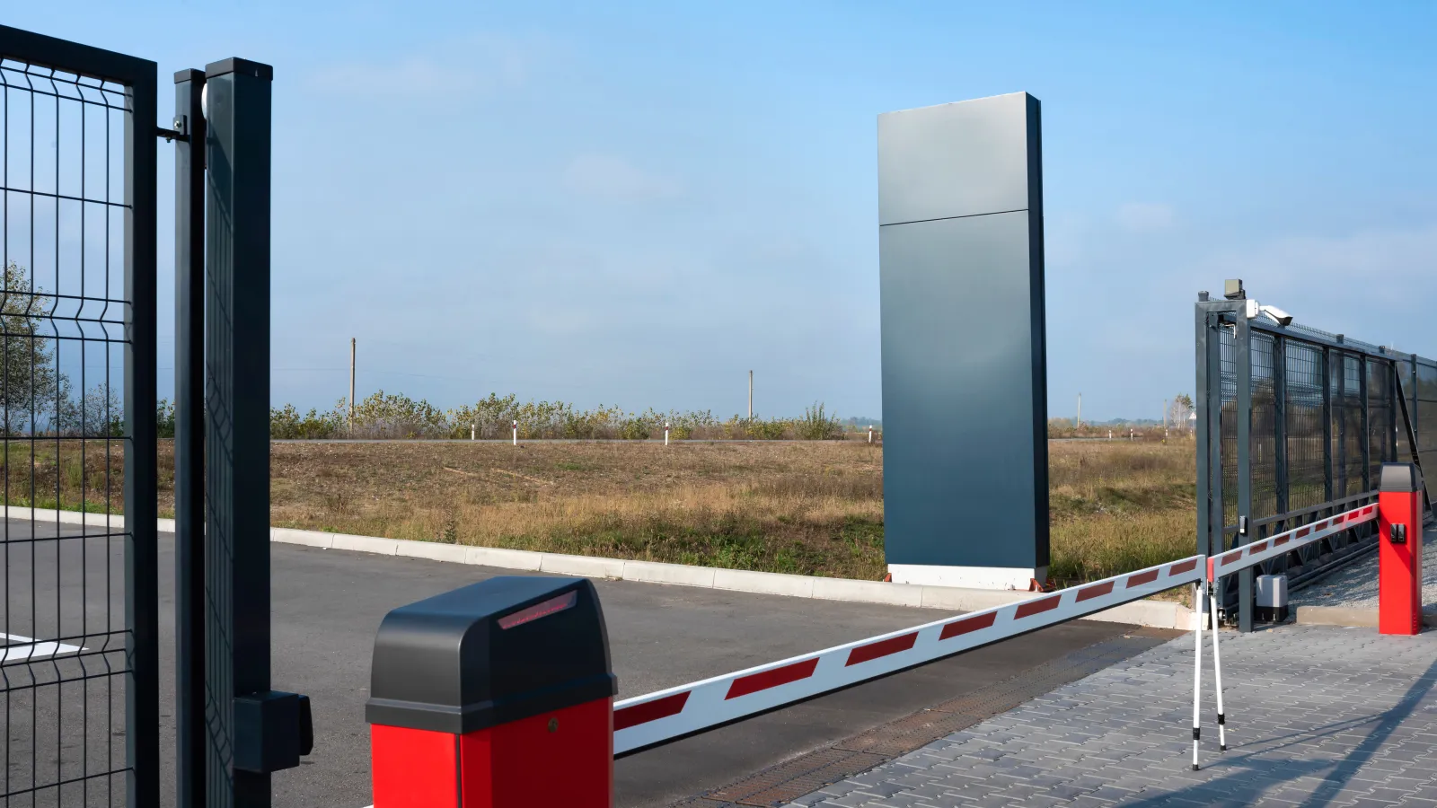 a white and red rectangular object on a road