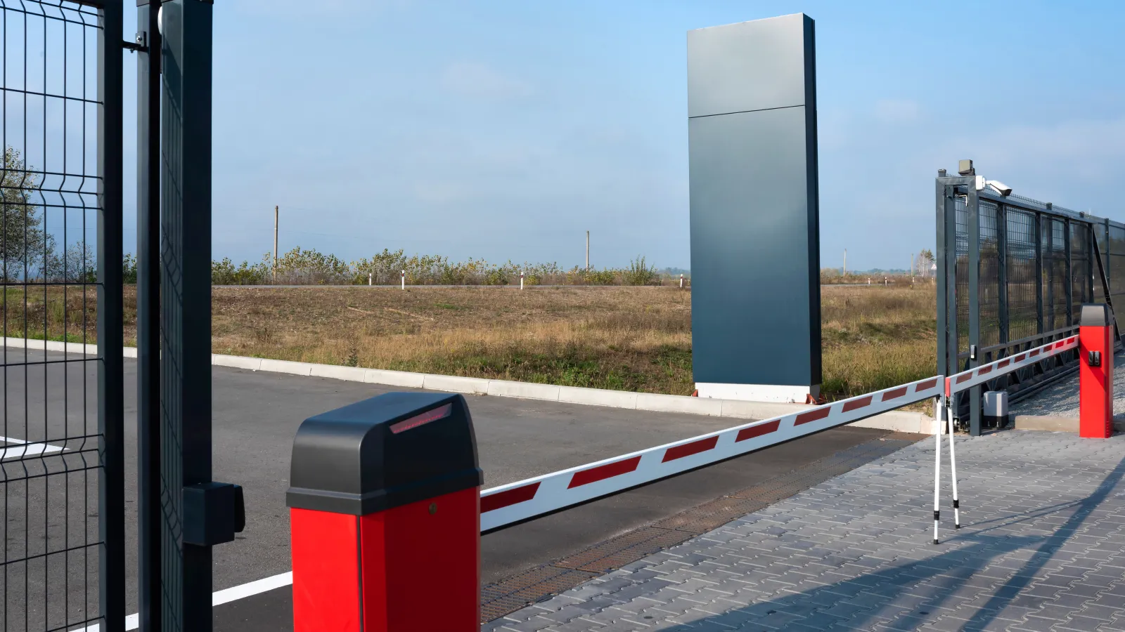 a white and red rectangular object on a road