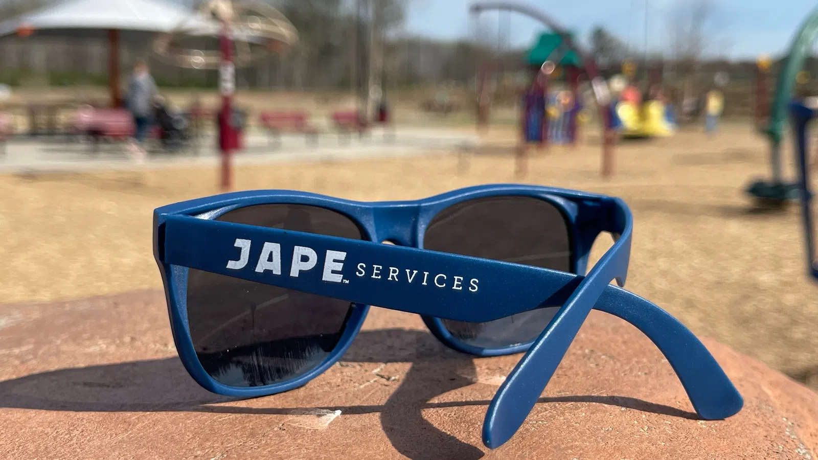 a pair of sunglasses on a beach