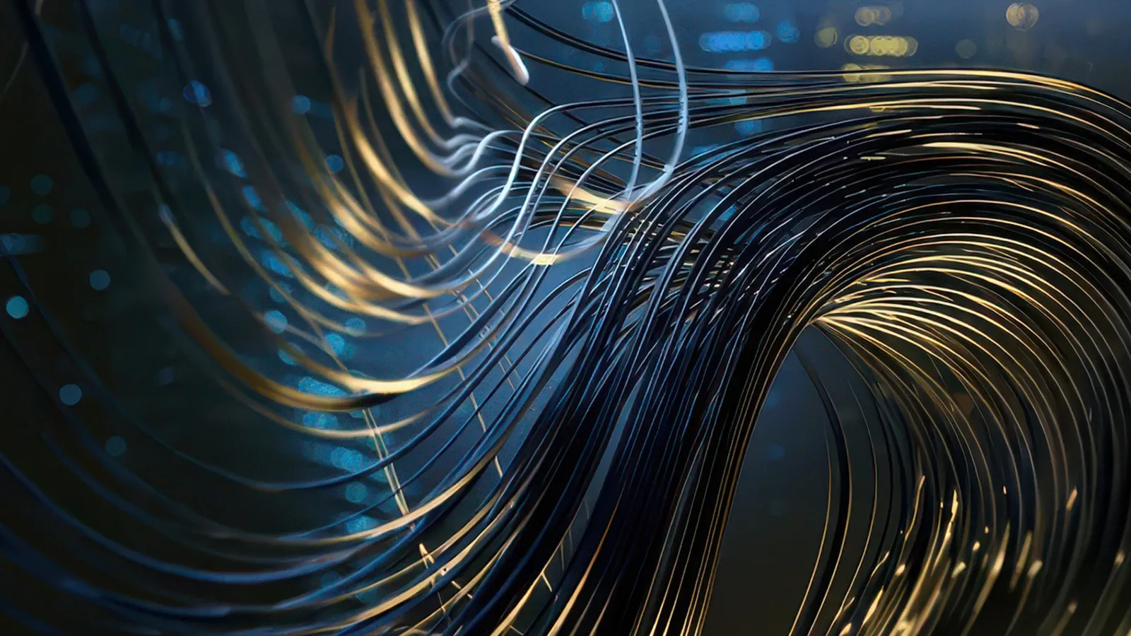 Abstract flowing black and gold metallic wires twisting dynamically against a dark blurred background.