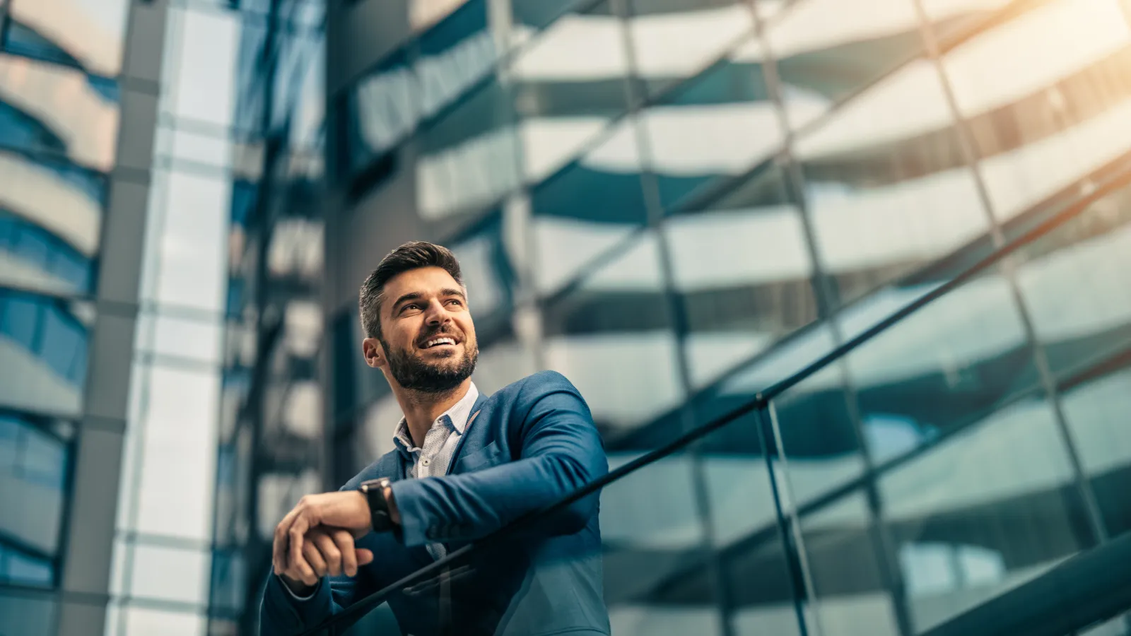 a man leaning against a railing