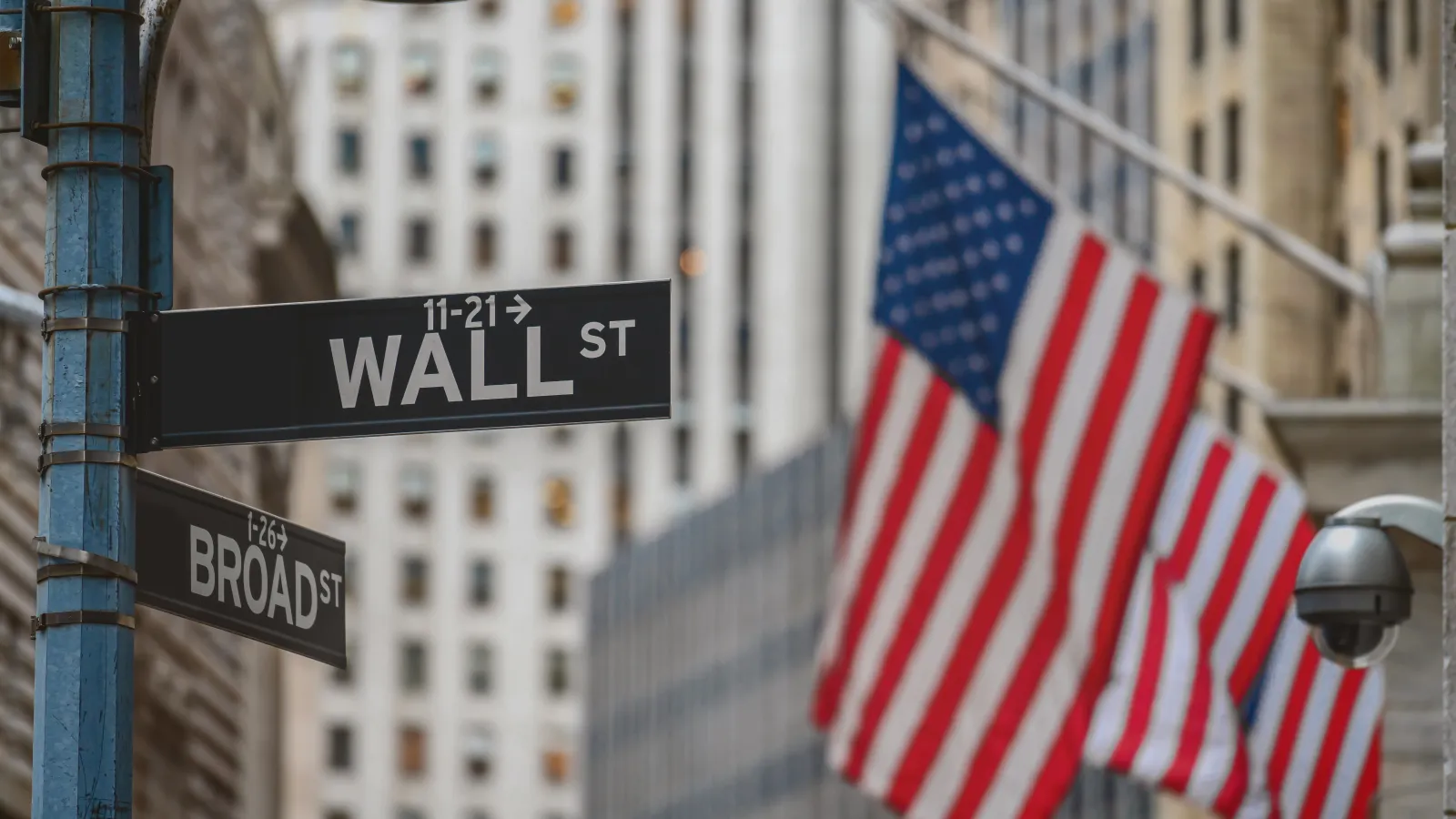 a street sign with a flag