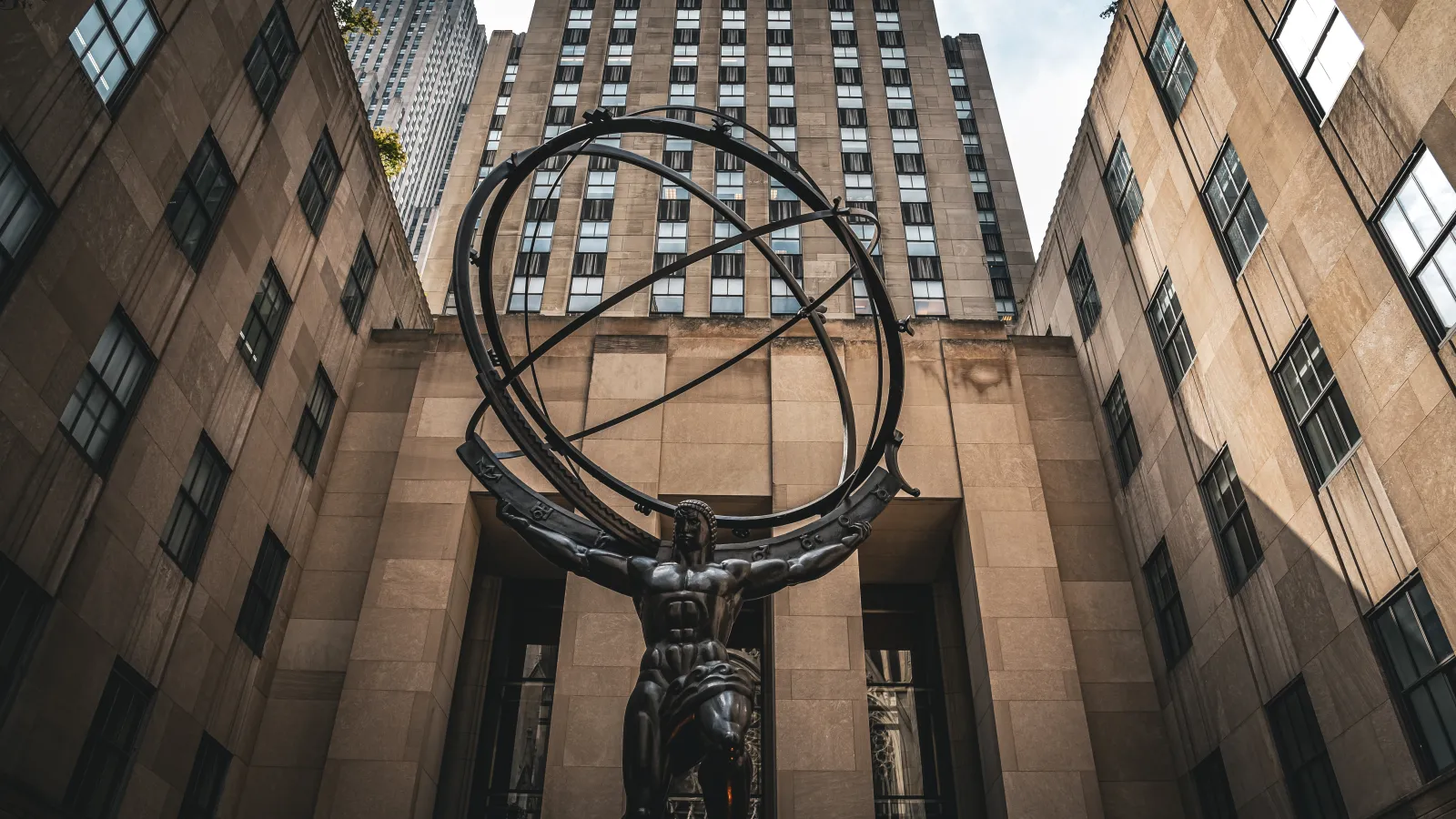 a statue in front of a building