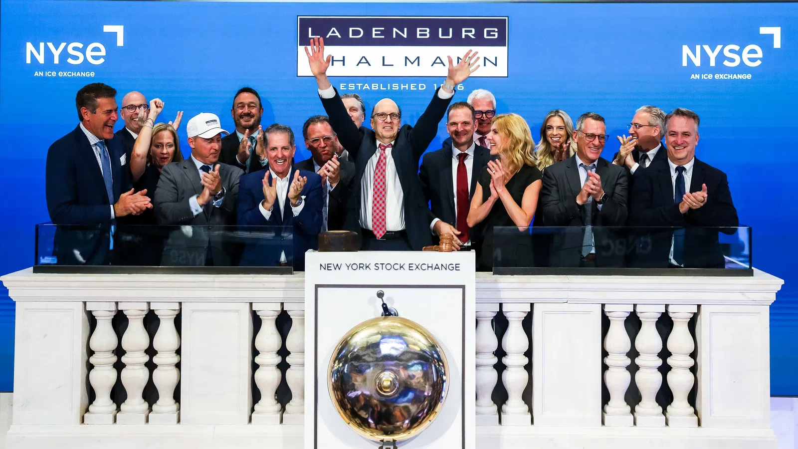 Group of professionals celebrating at the New York Stock Exchange closing bell ceremony on July 9, 2026.