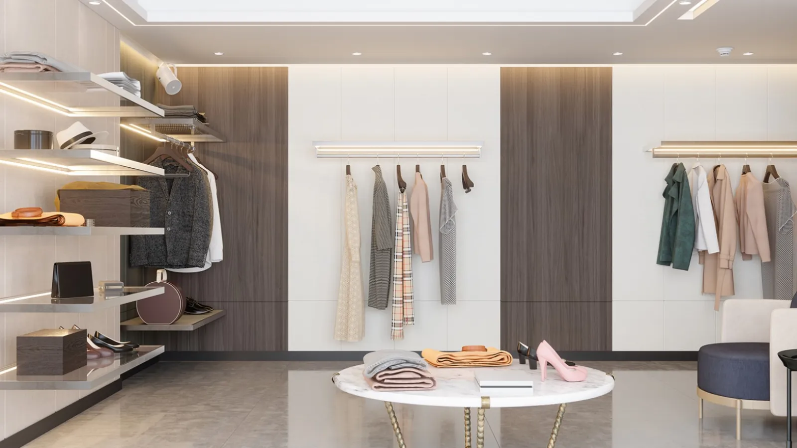 Modern retail clothing store interior with hanging garments, illuminated shelves, and a central marble table.