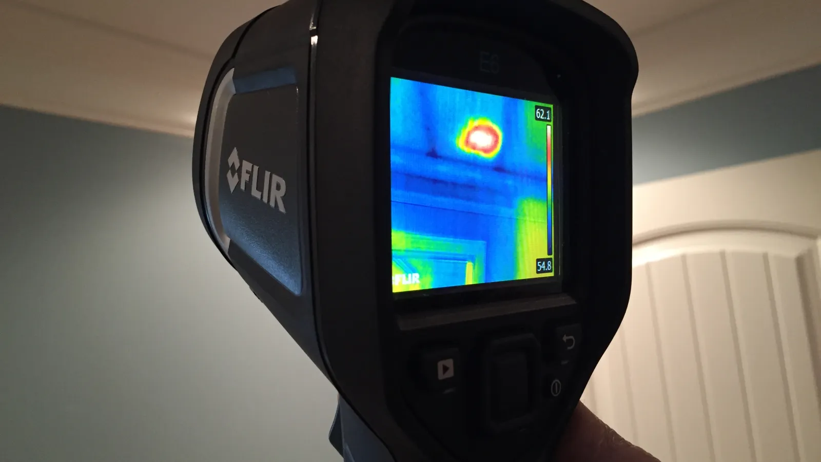 a hand holding an infrared camera